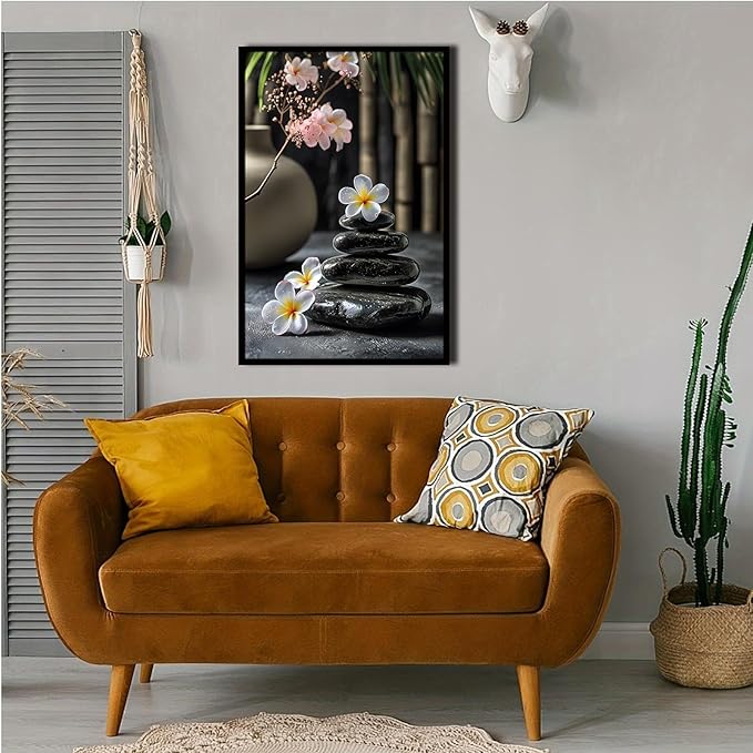 A harmonious black stone stack paired with white and pink flowers bamboo and ceramic vases creates a tranquil Zen decor for minimalist homes and mindful spaces 24x36in Metal blackFramed