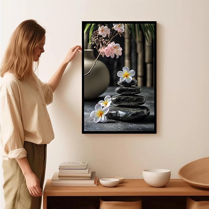 A harmonious black stone stack paired with white and pink flowers bamboo and ceramic vases creates a tranquil Zen decor for minimalist homes and mindful spaces 16x24in Metal blackFramed