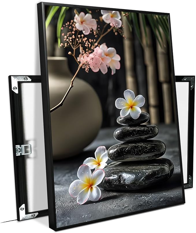 A harmonious black stone stack paired with white and pink flowers bamboo and ceramic vases creates a tranquil Zen decor for minimalist homes and mindful spaces 20x30in Metal blackFramed