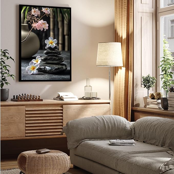 A harmonious black stone stack paired with white and pink flowers bamboo and ceramic vases creates a tranquil Zen decor for minimalist homes and mindful spaces 20x30in Metal blackFramed